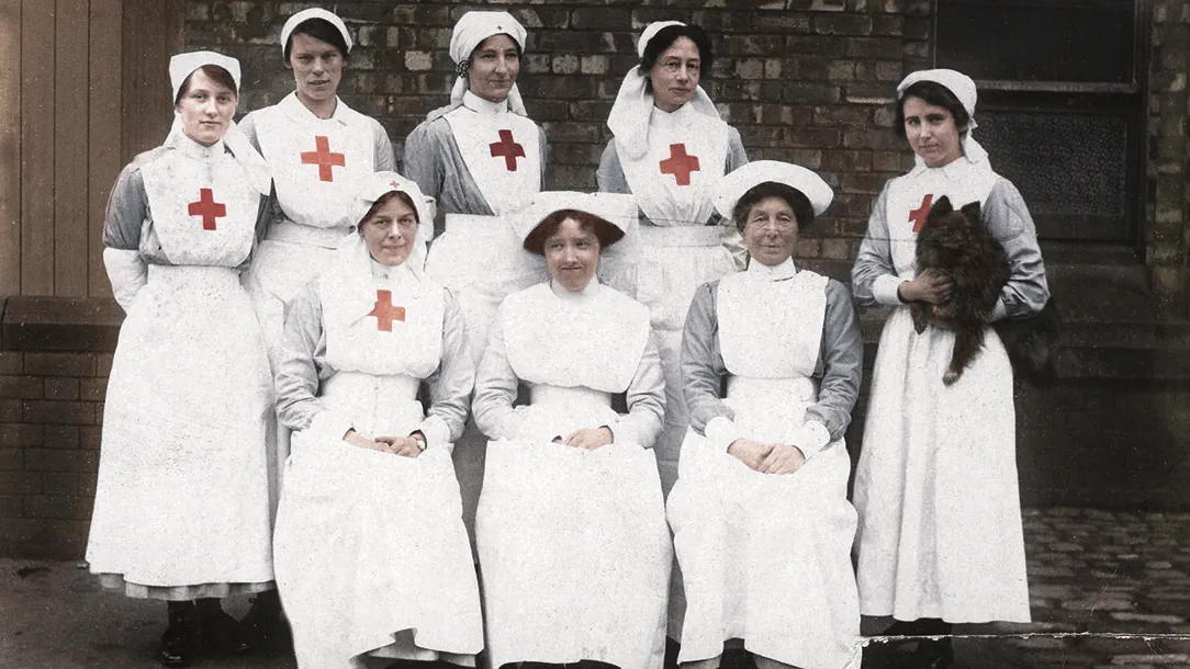A group of British Red Cross volunteers smile for the camera. 