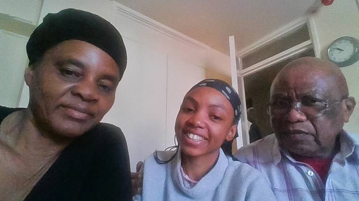 A reunited refugee family together in their new home in Leicester, UK.