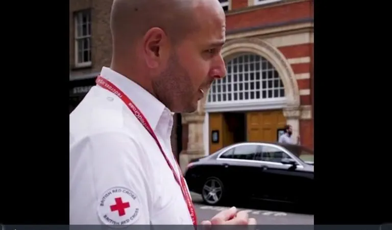 Side portrait photo of British Red Cross staff member