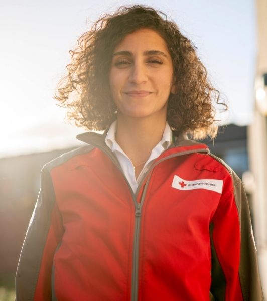 British Red Cross volunteer, Tala, smiles at the camera.