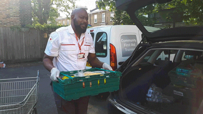 Emergency response volunteer Emmanuel delivers food