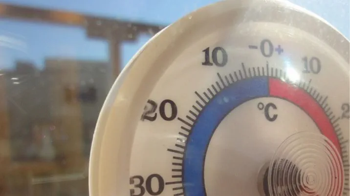 A photograph of a thermometer showing a high temperature on a very hot day.