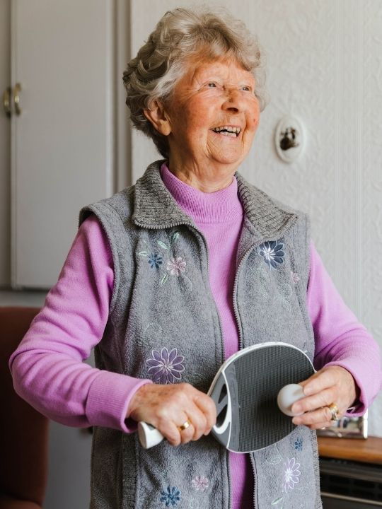 Auntie Aileen loves playing with the ping pong set the British Red Cross gave her.