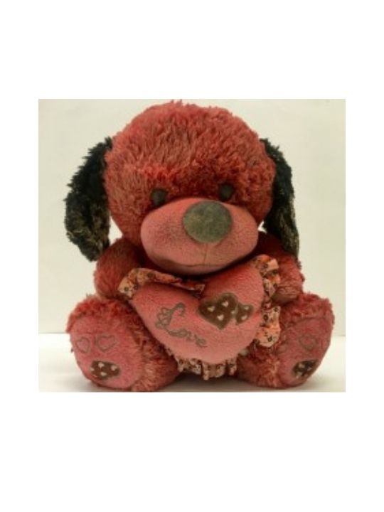 A very dirty pink stuffed teddy bear toy that was found in a deserted home in Iraq.