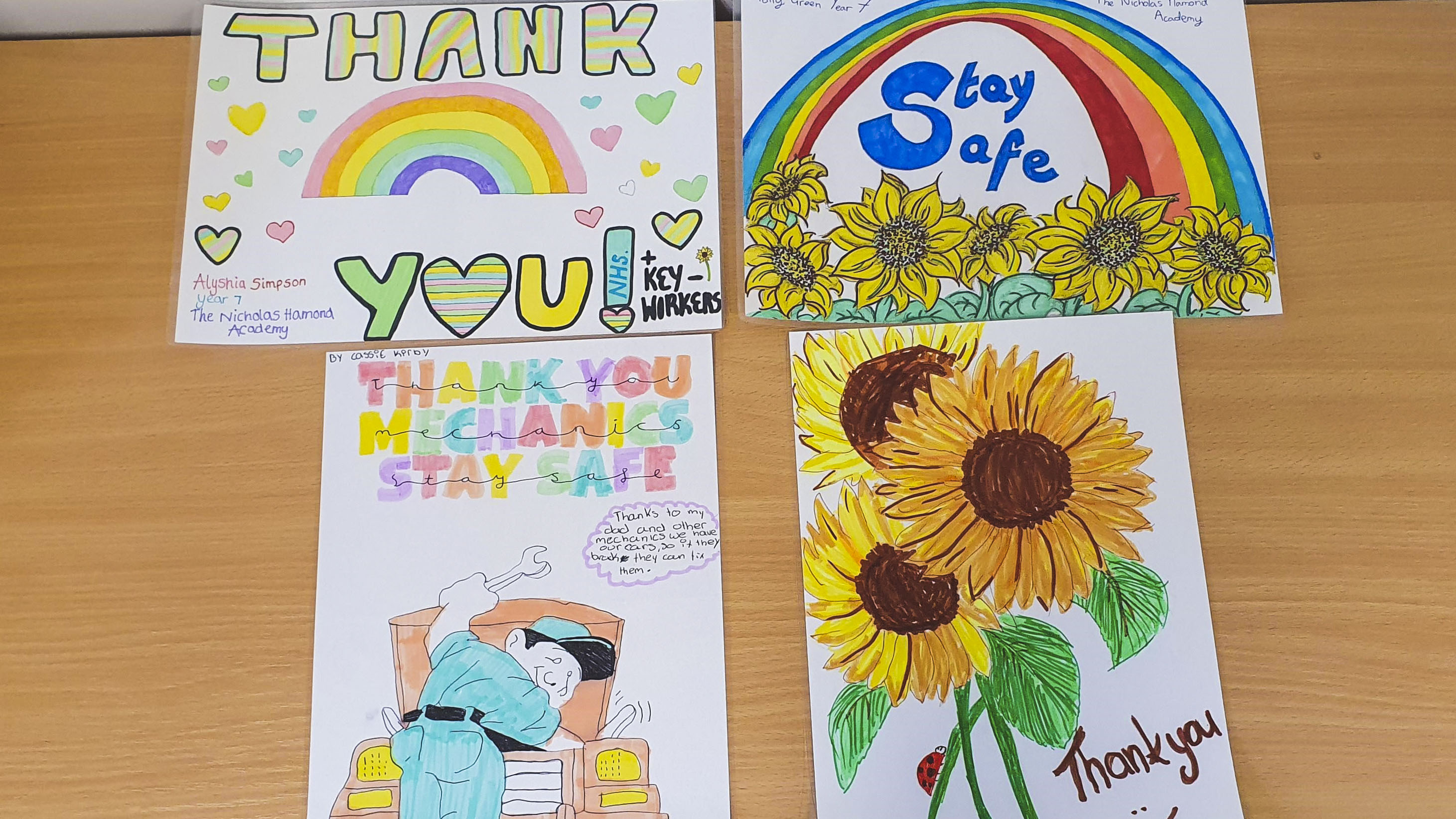 Collections of children's artwork containing messages in support  of key workers