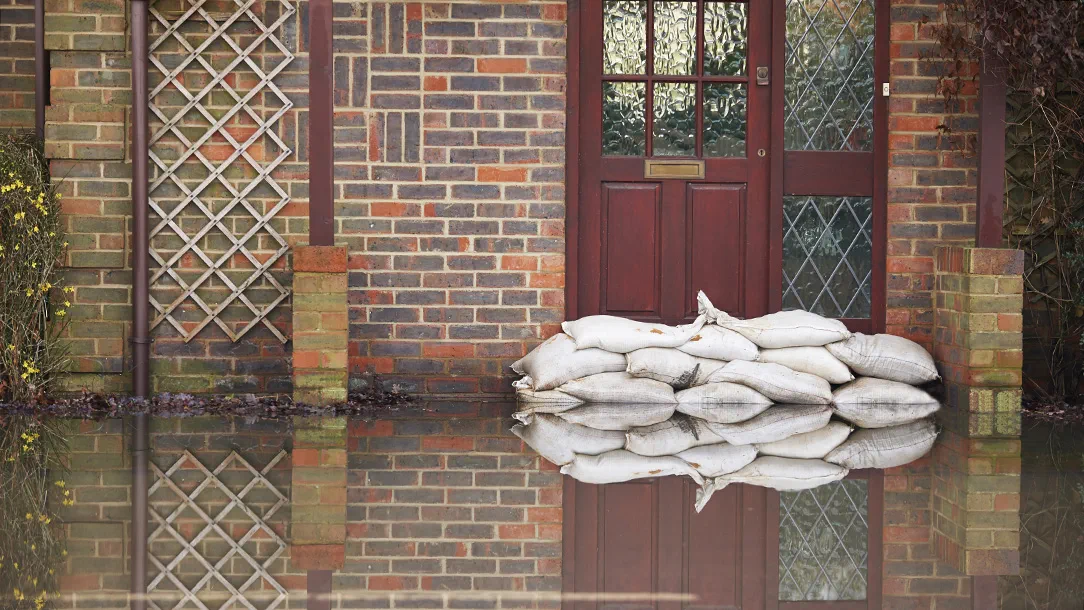 Front door with flood protection during UK floods.