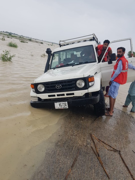 A Pakistan Red Crescent van seen parked in flood water