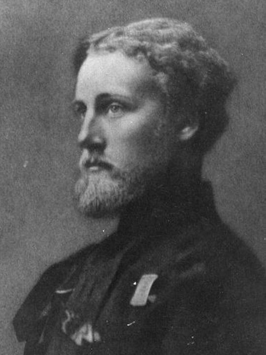 Black and white photograph of Captain Loyd Lindsay, later first chairman of the British Red Cross. The photograph is a side portrait of the captain featuring him with a beard and slightly curled hair.