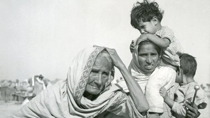 Black and white photo of a grandmother, mother and two children