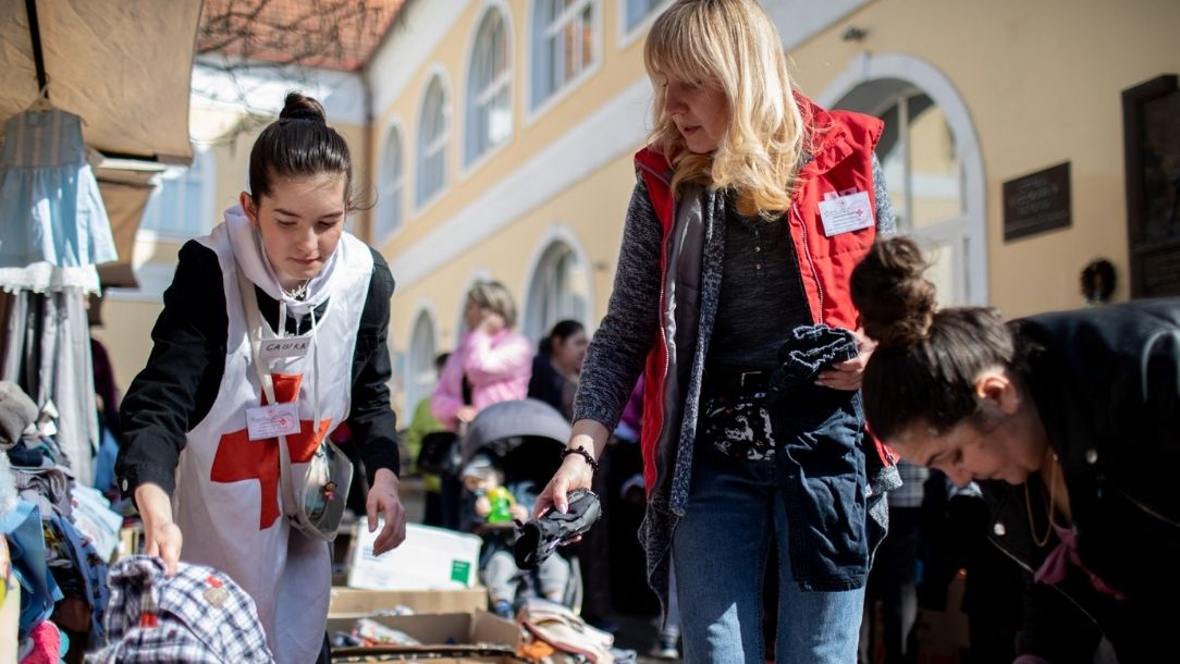 Ukrainian Red Cross staff and volunteers sort through suitable clothing for those in need.