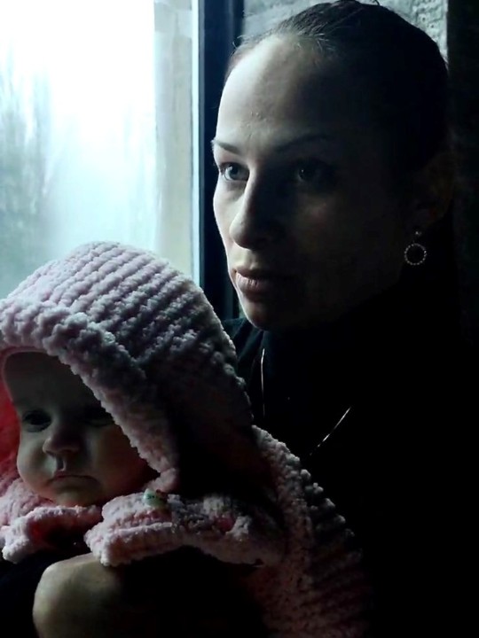 Yulia, a mother of seven, and her daughter are seen at a shelter in Mariupol where the ICRC and URCS have been carrying out distributions