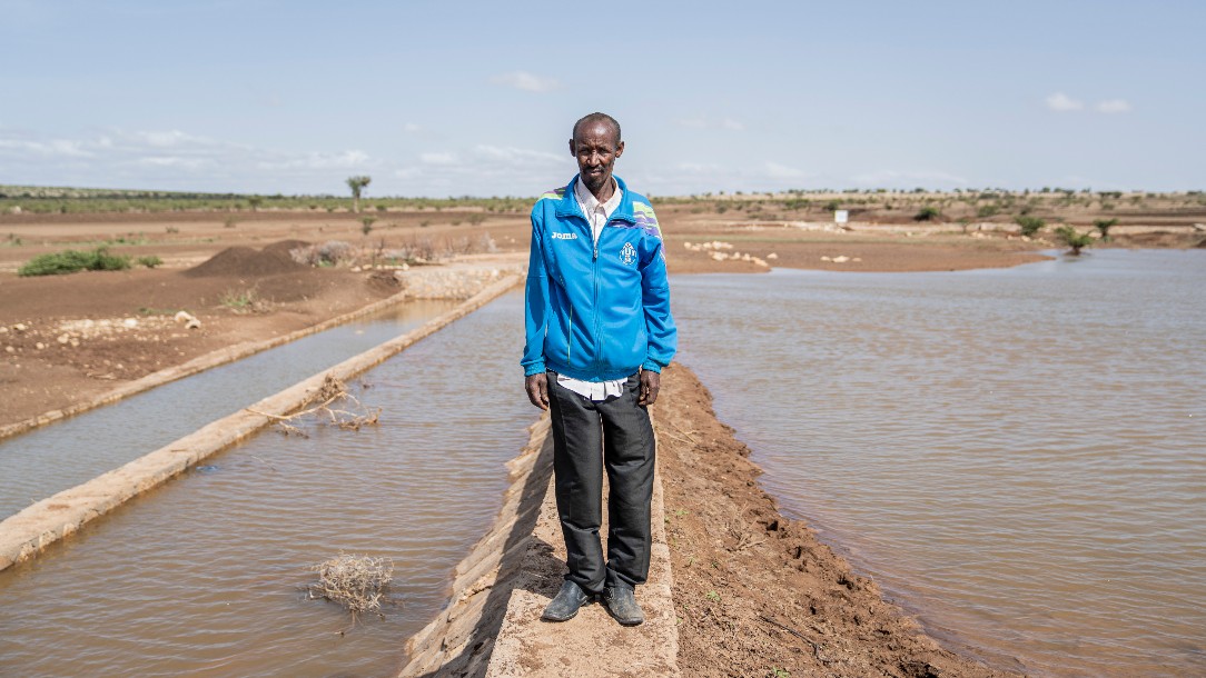 A man stands on a weir full of water in Ethiopia