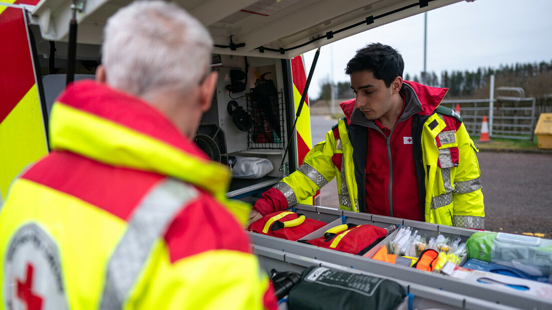 Red Cross staff unpack crisis response vehicles.
