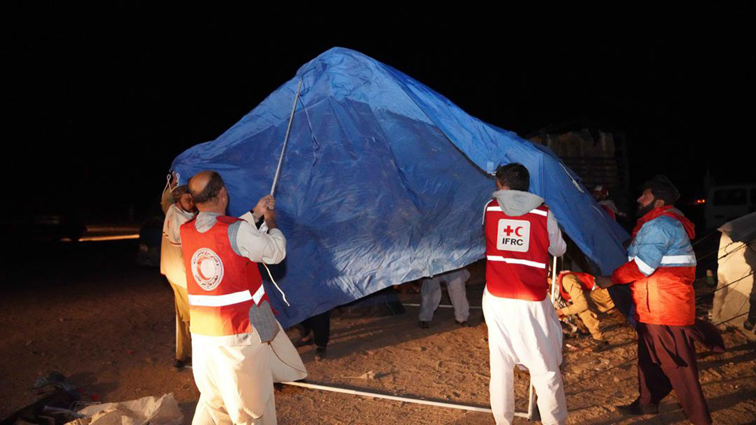 Afghan Red Crescent set up tent following Afghanistan earthquake.