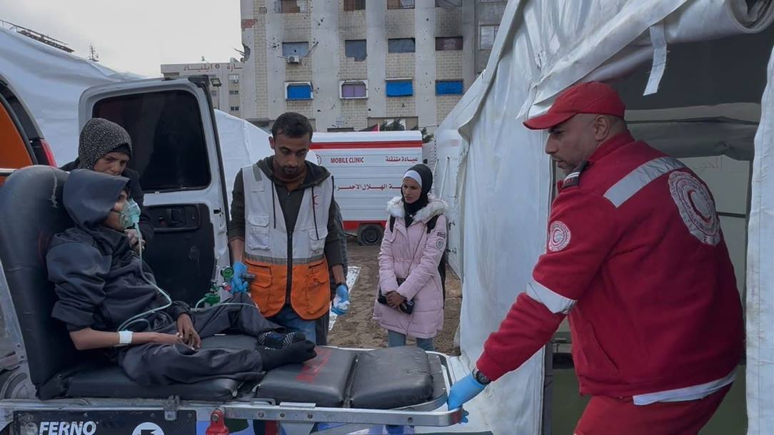 A man is wheeled into a field hospital in Al-Saraya in Gaza.