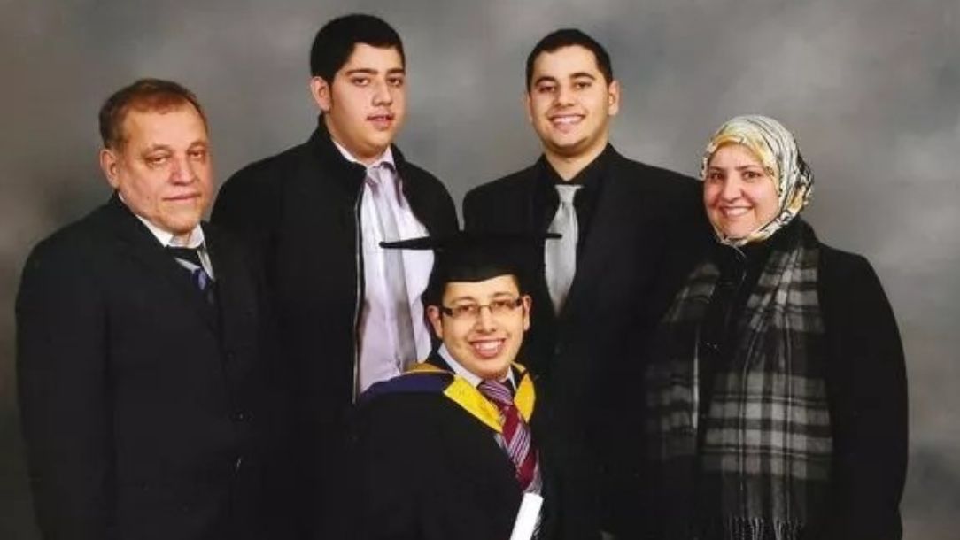 A photograph of the Amiri family at their son Hussein's graduation. The family fled from Afghanistan and now live in Wales.