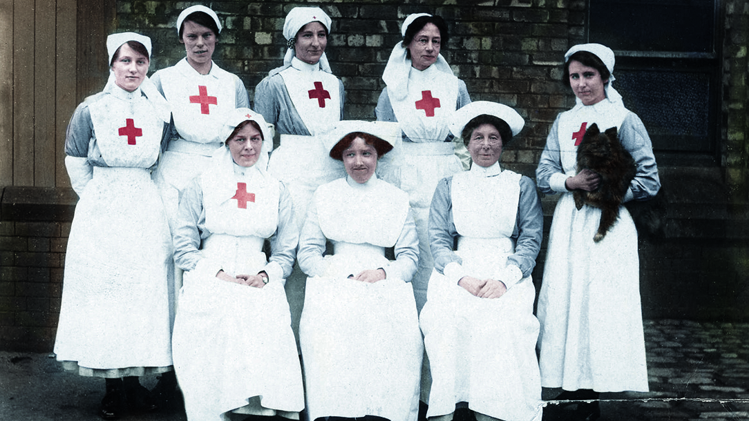 A group of British Red Cross volunteers smile for the camera. 