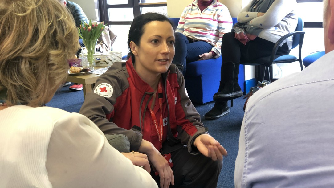 British Red Cross volunteer talks to the family of someone who has been quarantined thanks to coronavirus
