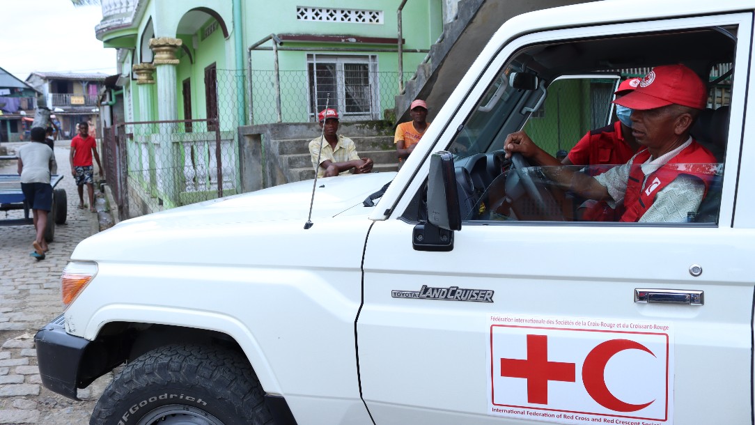 A man driving an IFRC vehicle surveys the scene in the aftermath of Cyclone Batsirai