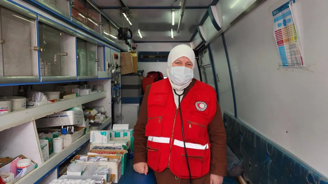 Dr Fatima in a mobile health centre. She is providing support to people affected by the Turkey-Syria earthquake.