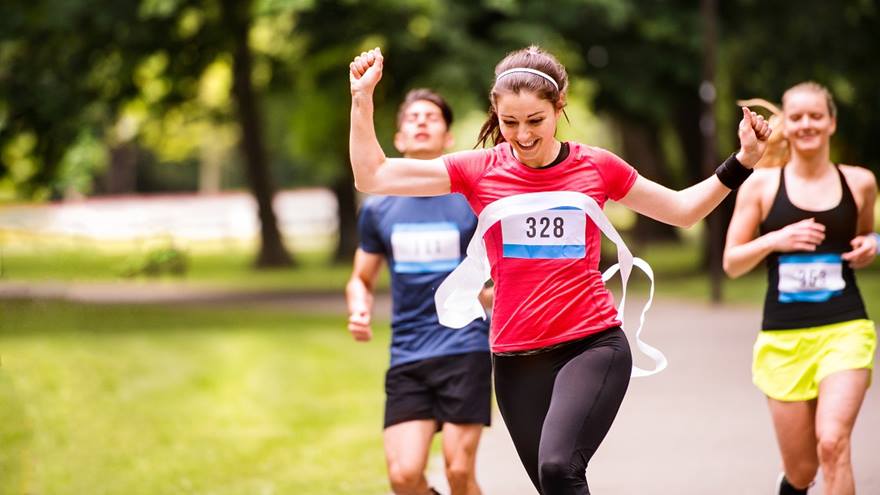 Edinburgh marathon runner crosses the finish line.