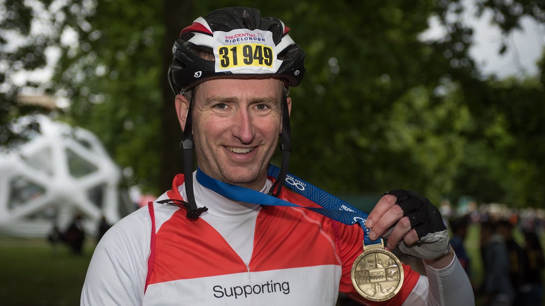 Cyclist with medal after finishing Prudential RideLondon 100