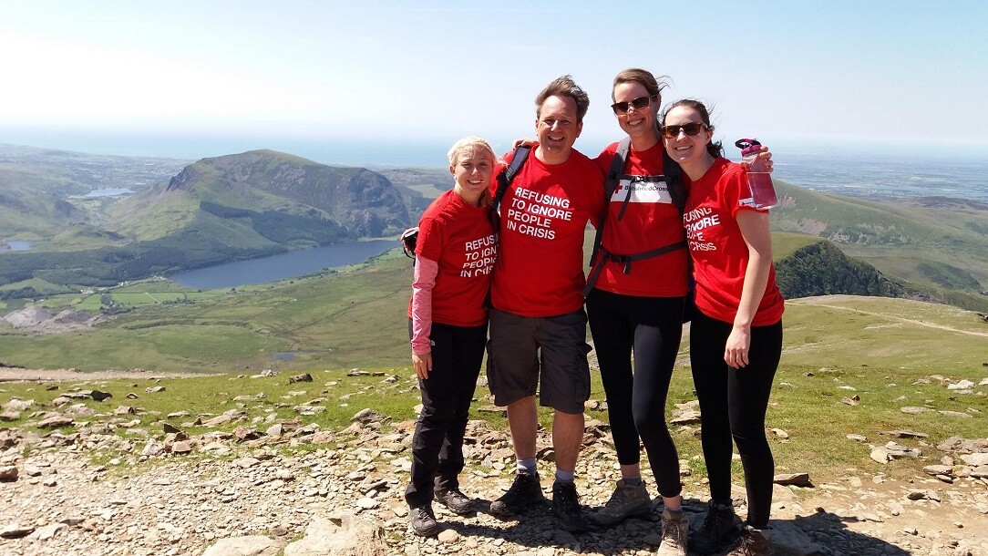 A group of friends trekking up Snowdon.