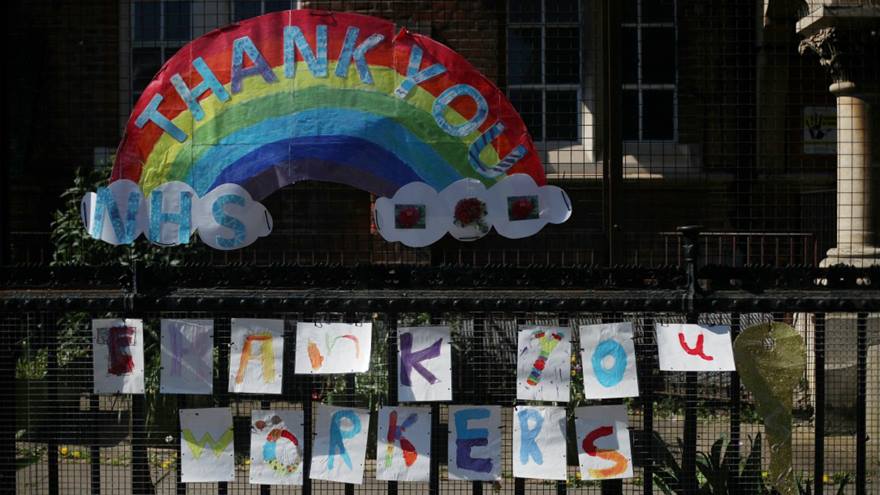 Photograph of a large drawing by children of a rainbow and the words "Thank you NHS - Thank you workers" during the coronavirus outbreak.