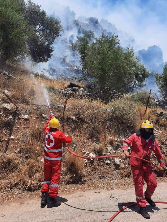 Greek Red Cross staff and volunteers tackle wildfire blazes in Greece.