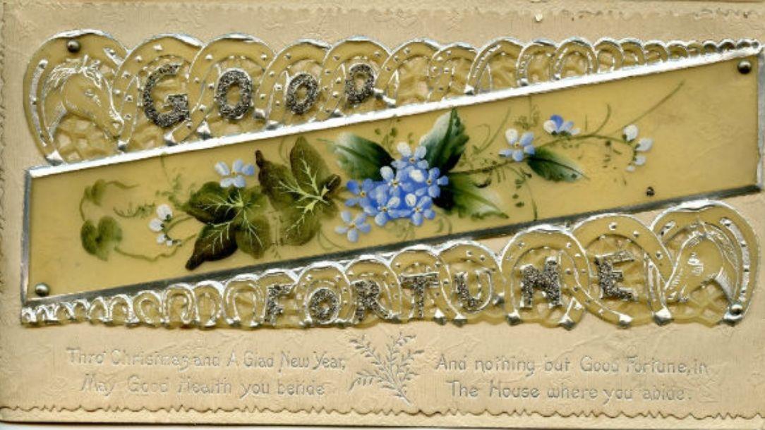A Christmas card with violet flowers in the middle and the phrase 'Good fortune' on the outer edges, handmade by Florence Nightingale.