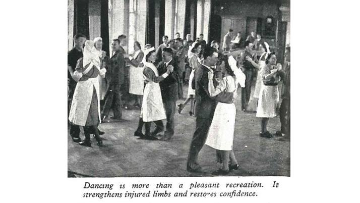 A black and white photograph showing nurses and soldiers dancing and the caption: "Dancing is more than a pleasant recreation. It strengthens limbs and restores confidence."