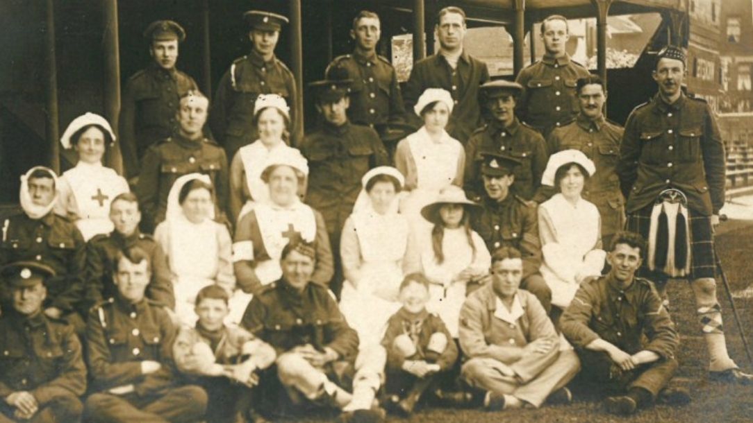 British Red Cross volunteers and injured servicemen at Trent Bridge auxiliary hospital, First World War