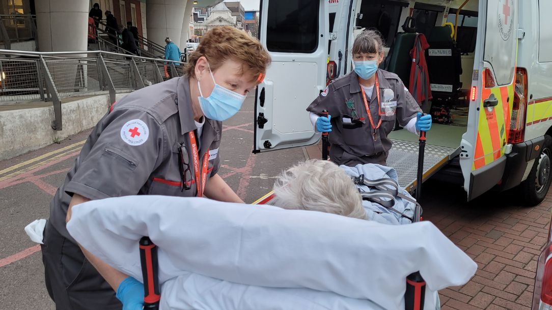 British Red Cross Ambulance Support Staff (Sue and Trish) transporting service user Sheila Wiltshire at Kings College Hospital emergency department in London.