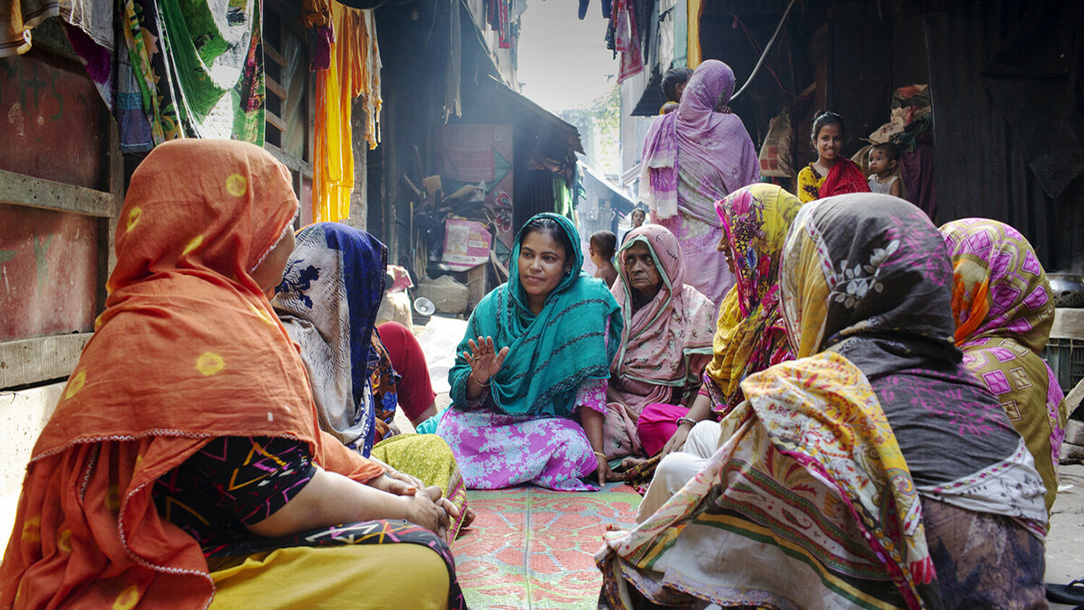Josna runs Women Squad meeting on streets of Barishal, Bagladesh.