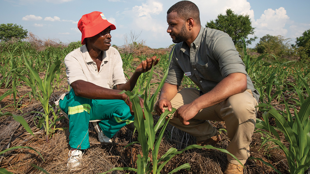 JB Gill with Red Cross volunteer and lead farmer Tadios Chikuko