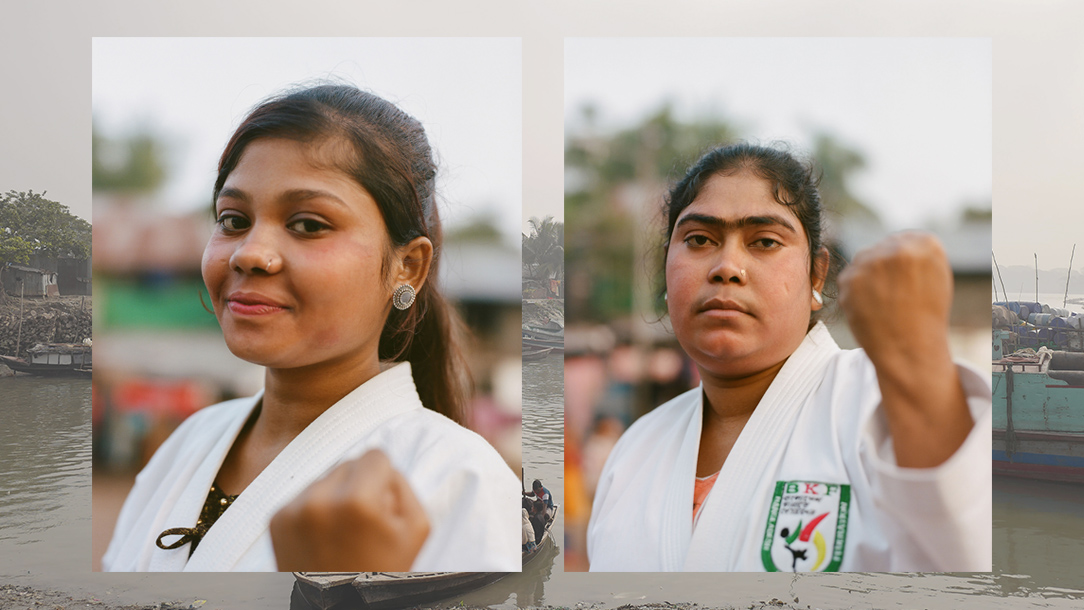 Two women photographed in their karate uniform.