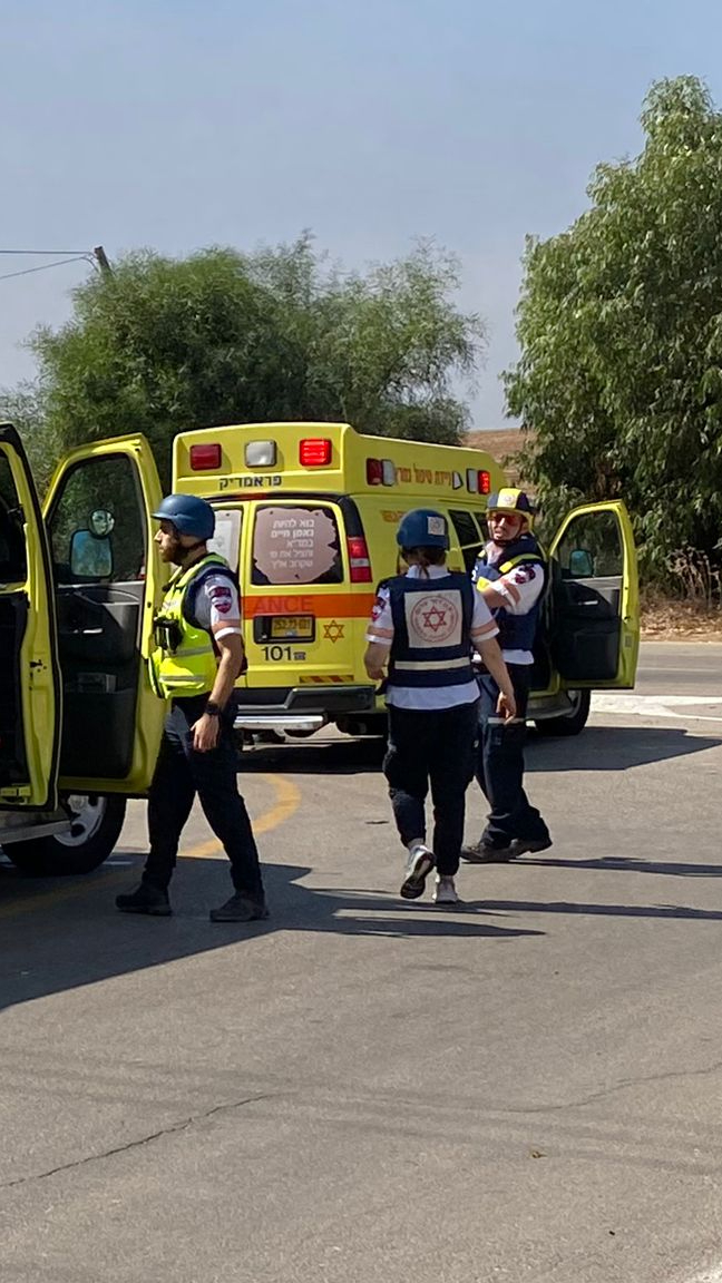 A group of Magen David Adom responders get out of ambulances.