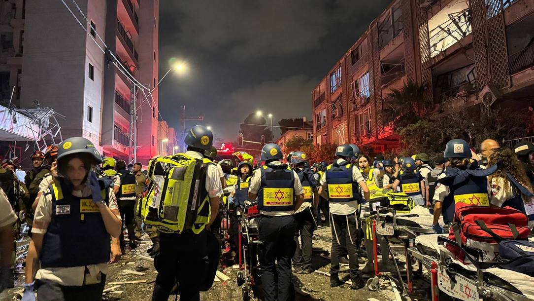 Magen David Adom rescue workers attend a location affected by Iranian missiles.