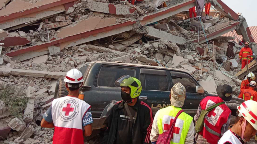 Rescue workers attend the aftermath of the Myanmar earthquake.