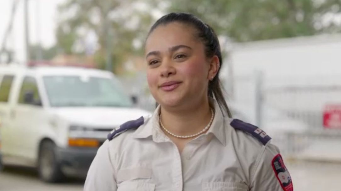 MDA responder Nara wears her MDA uniform and looks at the camera, after responding to atrocities in Israel.