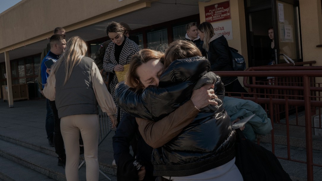 A woman is reunited with her mother and brother, after being separated while fleeing Ukraine