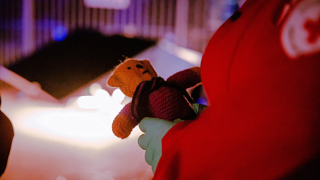 Volunteer holds teddy