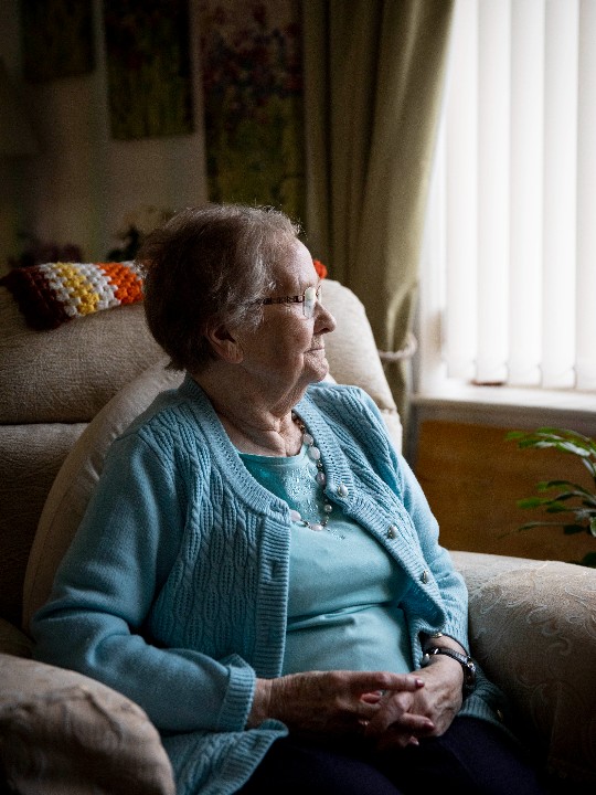 Eunice, 88, sits by the window at her home in Manchester in a photo taken in September 2021