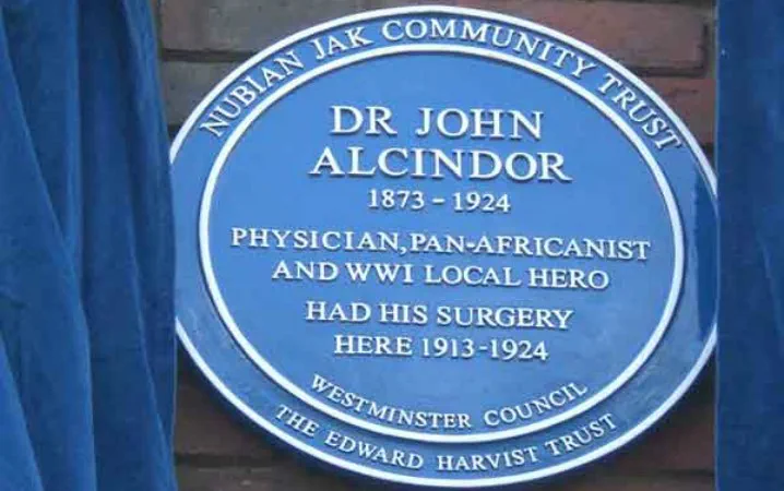Blue plaque dedicated to Dr John Alcindor.