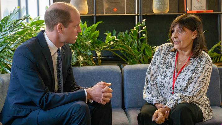 Prince William speaks to British Red Cross staff member