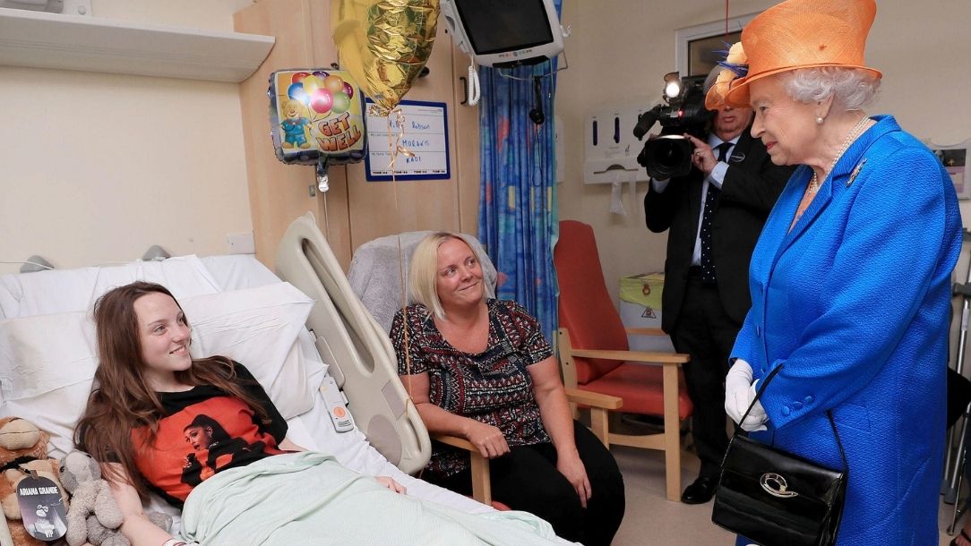 Her Majesty Queen Elizabeth visits a girl in hospital who has been injured by the Manchester Arena bombing.