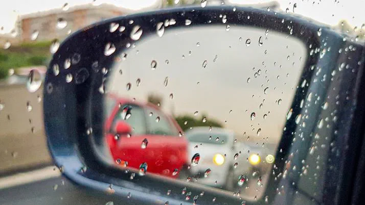 Rain on car wing mirror