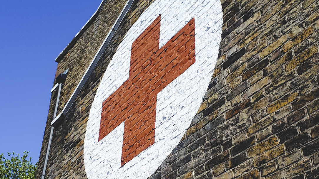 British Red Cross emblem on the outside wall at the refugee centre.