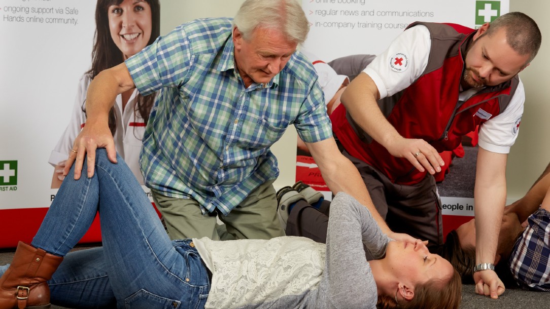 British Red Cross first aid at work workshop demonstration.