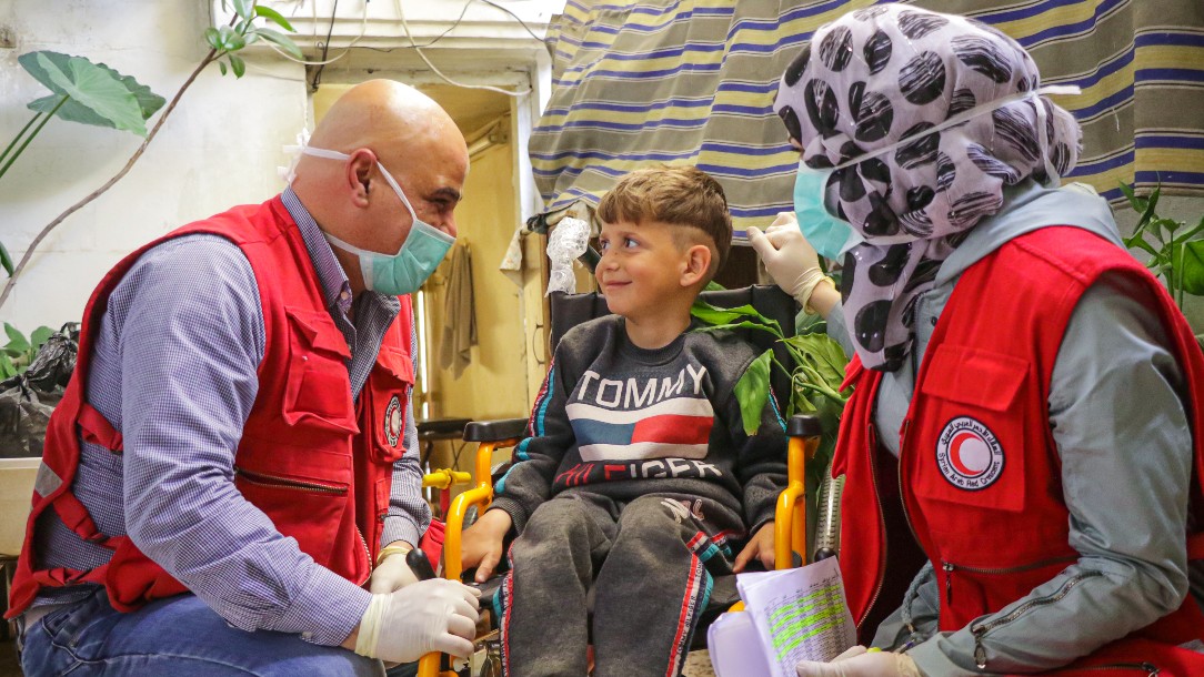 Six-year-old Ahmad receives his new wheelchair from the Syrian Arab Red Crescent. He is one of many who benefit from the mobility aid service provided by the Syrian Arab Red Crescent.